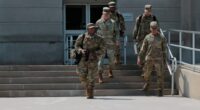 National Guard members descending steps.