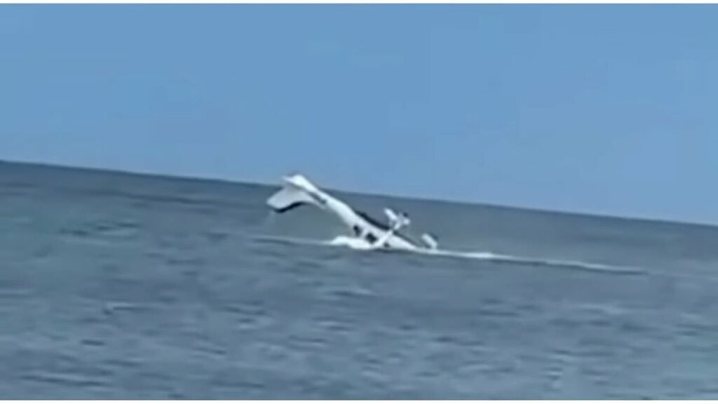 Dramatic video captures moment pilot is rescued from submerged plane