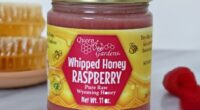 Jar of Queen Bee Gardens Whipped Honey Raspberry.