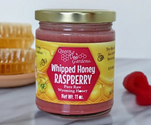 Jar of Queen Bee Gardens Whipped Honey Raspberry.