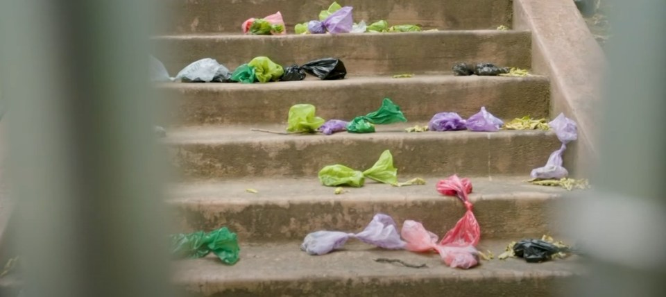 Plastic bags scattered on a staircase.