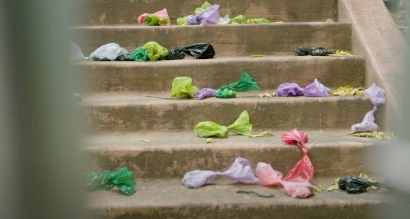 Plastic bags scattered on a staircase.