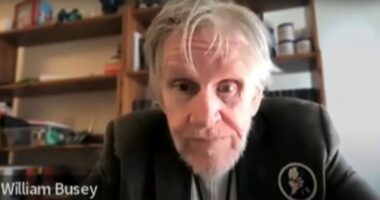 Headshot of William Busey.