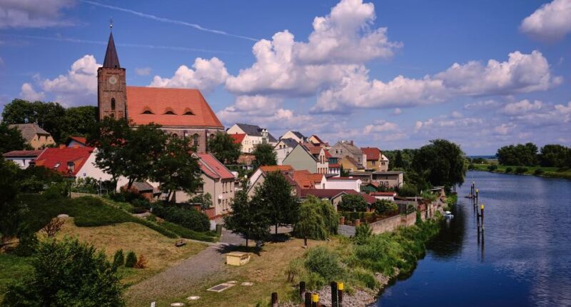 View of Eisenhuttenstadt, Germany, with a church and river.
