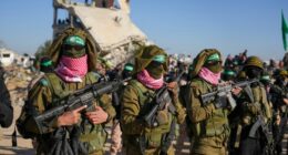 Hamas fighters stand in formation ahead of a hostages' release in Khan Younis, Gaza Strip, Saturday, Feb. 15, 2025. (AP Photo/Abdel Kareem Hana)