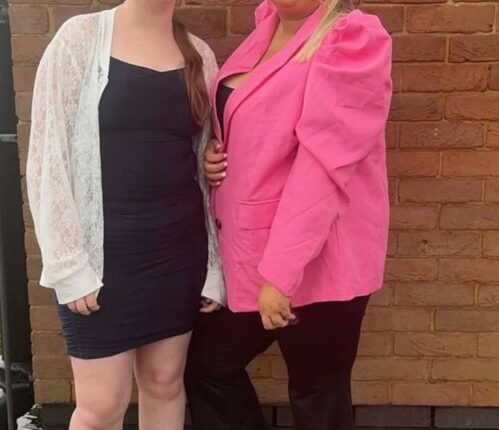 Two teenage girls posing for a photo.