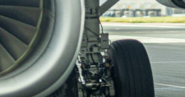 Story from Jam Press (Plane Tyre Terror) Pictured: The exploded tyre (left). VIDEO: Brit holidaymakers terrified after plane tyre explodes in freak one-in-10,000 take off accident A Brit family jetting home from a Mediterranean holiday were terrified after a plane tyre exploded in a freak one-in-10,000 take off accident. Kris Sadler was petrified when the blow out happened just as the plane was about to lift off. He videoed the shocking explosion and the scary vibrations it caused to the wing. Kris was returning from Corfu to Birmingham, with wife Katie and sons, Olly, 13, and Zach, 9. They were on a TUI jet when the nerve shredding blast happened. "It was scary," Kris, from Telford, Shropshire, told, Luxury Travel Daily. "There were bits of tyre flying everywhere. "The whole wing was rippling. "I knew something was wrong but the crew took two hours to tell us. "I don't blame them - the crew were brilliant. "The pilot was good - thank goodness we had a pilot who trains other pilots. "He told us he was handing over to his co pilot to fly us home. "But later he told us he would be landing because we'd lost a tyre. "He said the plane was a hundred per cent safe but passengers had to take precautions and go into the brace position. "And as we came into touch down the crew were saying, 'heads down, heads down, heads down' repeatedly which kind of makes you panic more. "It was pretty crazy. "It's a one-in-10,000 chance of a plane tyre blowing - so that's mine tocked off. "It's probably never going to happen again." The photographer added that emergency crews were prepared when they landed at Birmingham. "They hosed down the broken wheel," he said. "It looked like there were sparks when we landed but the landing was very good. "It was a bit bumpy because it was running on a flat tyre. "But it has other tyres so I suppose we knew we'd be OK. "I was just trying to hold it together for the kids - and my wife was trying to hold it together. "And she did until we landed and then it all came out. "I was saying to them, 'it's all ok' but I was thinking, 'bloody hell if this goes wrong'. "I didn't know if there was more damage to the landing gear - and nor did the crew. "But the pilot lowered the landing gear 15 minutes before we were due to land and I know they never do it that early. "Then a black military jet appeared next to us and flew all the way in to landing with us. "It had come to scout out the landing gear and tyre to see if it was OK. "All the passengers cheered and clapped when we landed. "The pilot came out and bowed. "I don't know how dangerous it really was. "We may never have been in danger - or it might have been very dangerous and the pilot just pulled it off. "There were some tears - but it was great to get back on solid ground and all safe." TUI has been approached for comment. ENDS EDITOR'S NOTE: Video Usage Licence: (NON-EXCLUSIVE) We have obtained a non-exclusive licence from the copyright holder. A copy of the licence is available on request. Video Restrictions: None.
