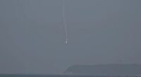 Light aircraft crashing into ocean.