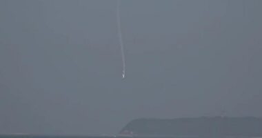 Light aircraft crashing into ocean.