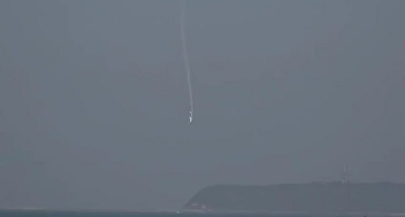 Light aircraft crashing into ocean.