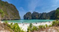 Maya Bay, Ko Phi Phi Lee Island, Thailand; beach with tourists.