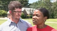 Couple being interviewed about a forged deed.