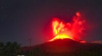 Mount Lewotobi Laki-laki volcano erupting at night.
