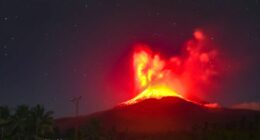 Mount Lewotobi Laki-laki volcano erupting at night.