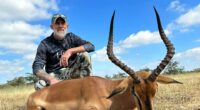 Hunter with harvested impala.