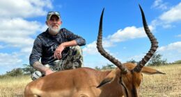 Hunter with harvested impala.