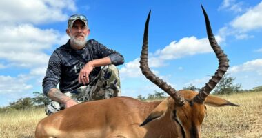 Hunter with harvested impala.