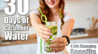 Young woman drinking fresh water with cucumber, lemon and leaves of mint from glass in the kitchen. Healthy Lifestyle and Eating. Health, Beauty, Diet Concept. I Drank Cucumber Water for 30 Days & Experienced 4 Life-Changing Benefits. Cover