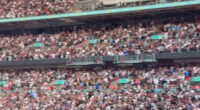 Thousands of Oasis fans at a sold-out Wembley Stadium concert.