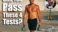 Muscular athlete walking and carrying two kettlebells in a parking lot. If You Can Pass These 4 Strength Tests After 45, Your Body Is Ahead of Its Time. Cover