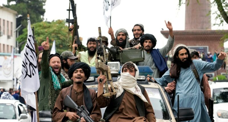 Taliban fighters celebrating their takeover of Kabul.