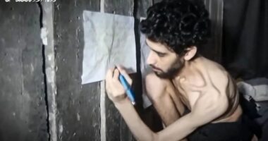 Screengrab of a malnourished Israeli hostage drawing on a wall.