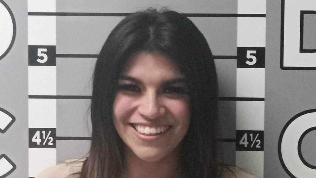 Jealous ex-girlfriend smiles in mugshot after trashing man's car