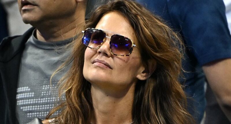 Katie Holmes looks stylish in a figure-hugging dress at the US Open