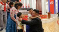 Kim Jong Un embracing children of fallen soldiers at an award ceremony.