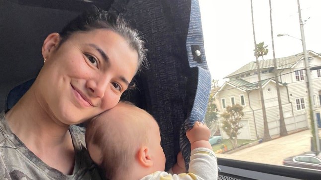 Woman holding a baby.