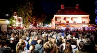 Large crowd at night during a festival in Abcoude, Netherlands.