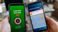 Two smartphones displaying online casino and sports betting apps.