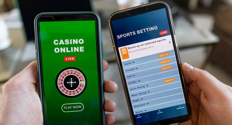 Two smartphones displaying online casino and sports betting apps.