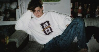 Photo of Amy Bradley sitting on a couch.