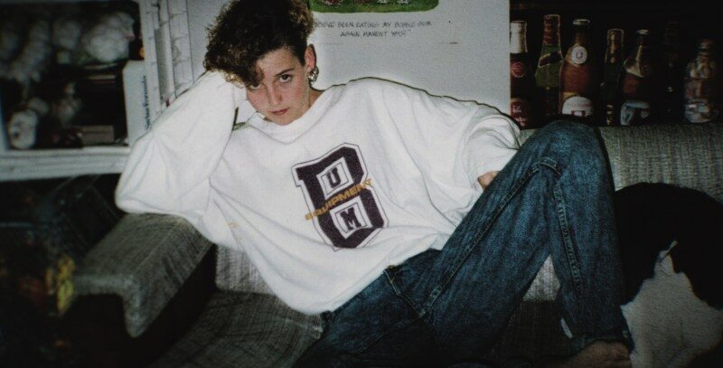 Photo of Amy Bradley sitting on a couch.