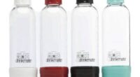 Four Drinkmate 1-liter carbonation bottles in white, red, black, and teal.