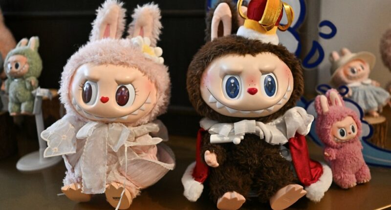 Mokoko and Labubu dolls at a Pop Mart exhibition.