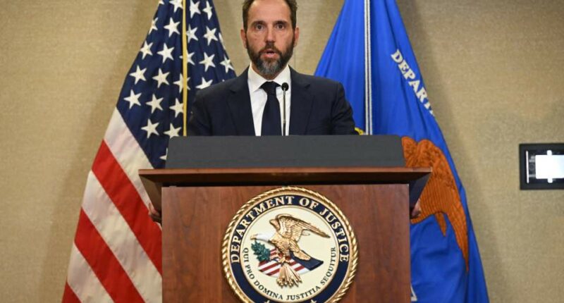 Special Counsel Jack Smith speaking at a podium.