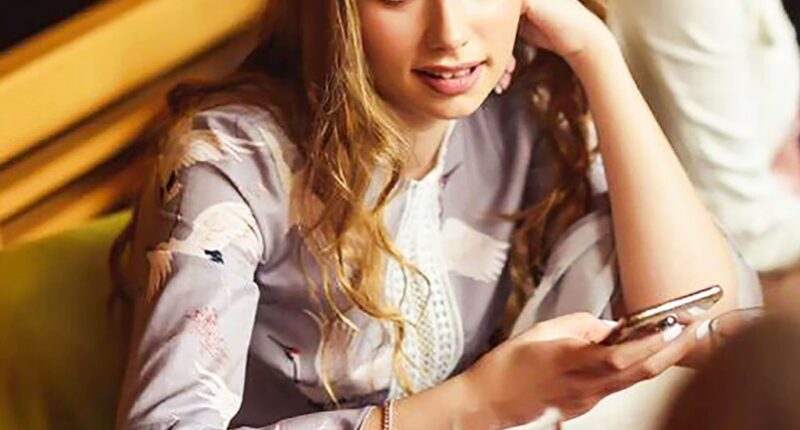 Young woman identified as Vladimir Putin's daughter.