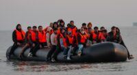 Migrants in a small boat in the English Channel.