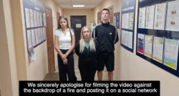 Three young adults standing in a police station hallway apologizing for filming a video.