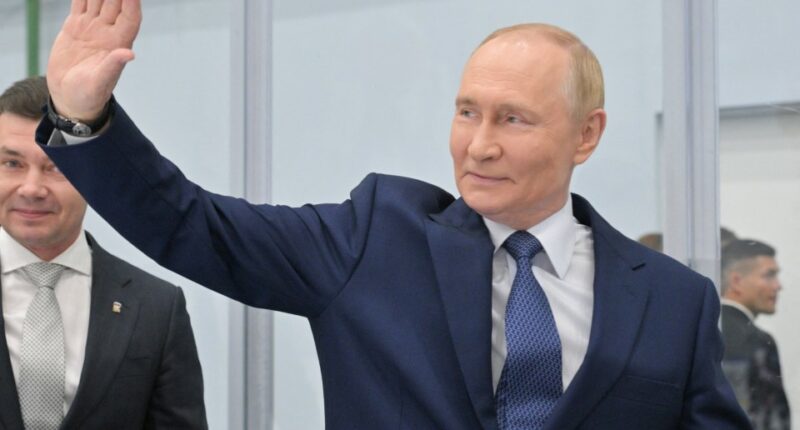 Vladimir Putin waving.