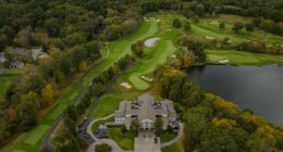 Aerial view of a golf course with clubhouse.