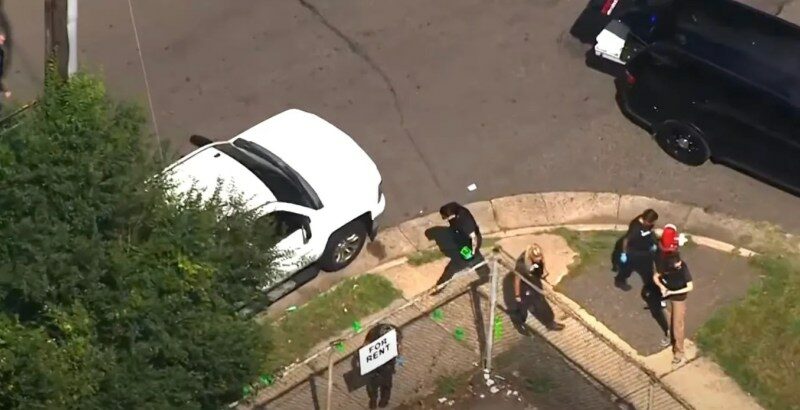 Screenshot of a shooting scene with first responders; one dead, six injured.