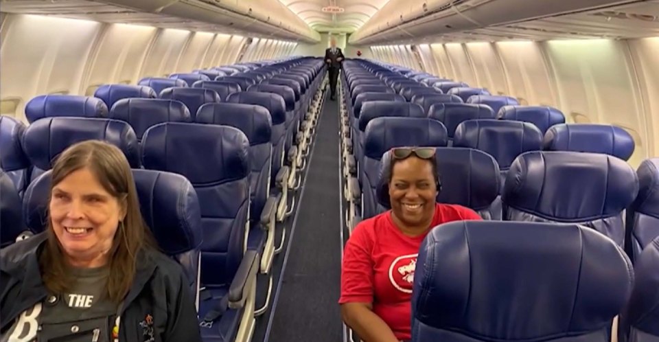 Two blind women seated on a Southwest Airlines flight.