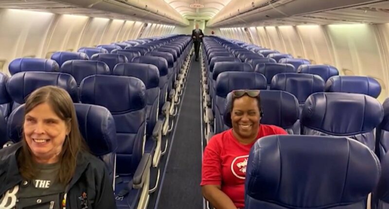 Two blind women seated on a Southwest Airlines flight.