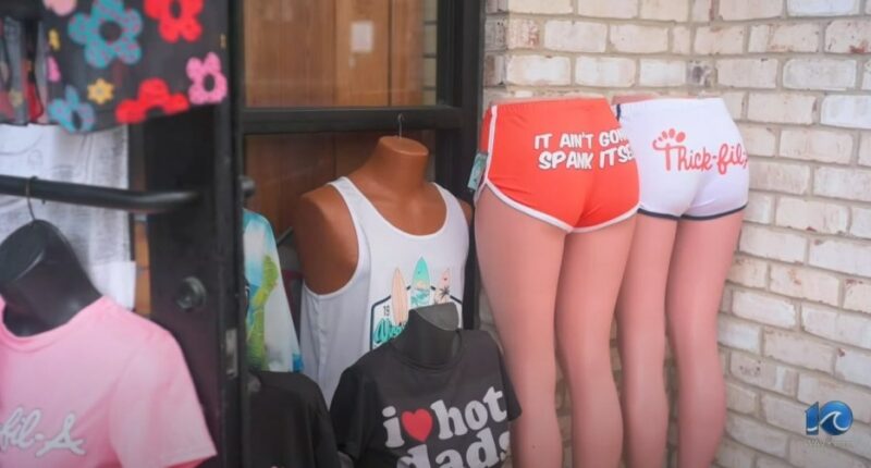 Provocative and profane merchandise displayed on mannequins in a Virginia Beach storefront.
