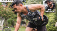 A fit and healthy asian man exercises outdoors at his home, doing one arm dumbbell rows on a bench.The 4 Strength Moves Every Man Over 50 Needs for Longevity. Cover