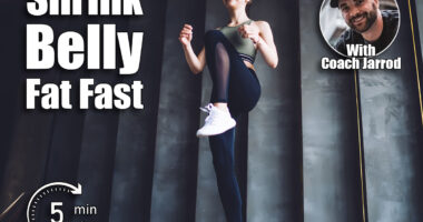 From below of full body slim cheerful female in sportswear doing high knee march step exercise in light spacious gym during workout. The 5-Minute Morning Routine That Shrinks Belly Fat Fast After 50. Cover