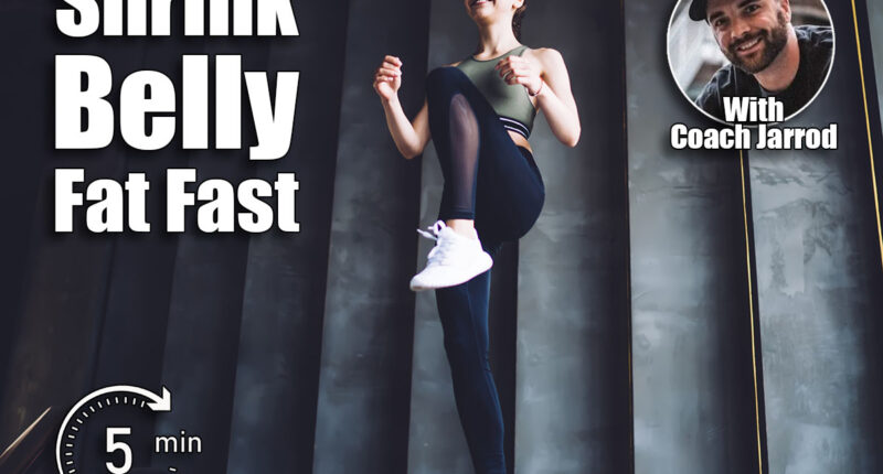 From below of full body slim cheerful female in sportswear doing high knee march step exercise in light spacious gym during workout. The 5-Minute Morning Routine That Shrinks Belly Fat Fast After 50. Cover